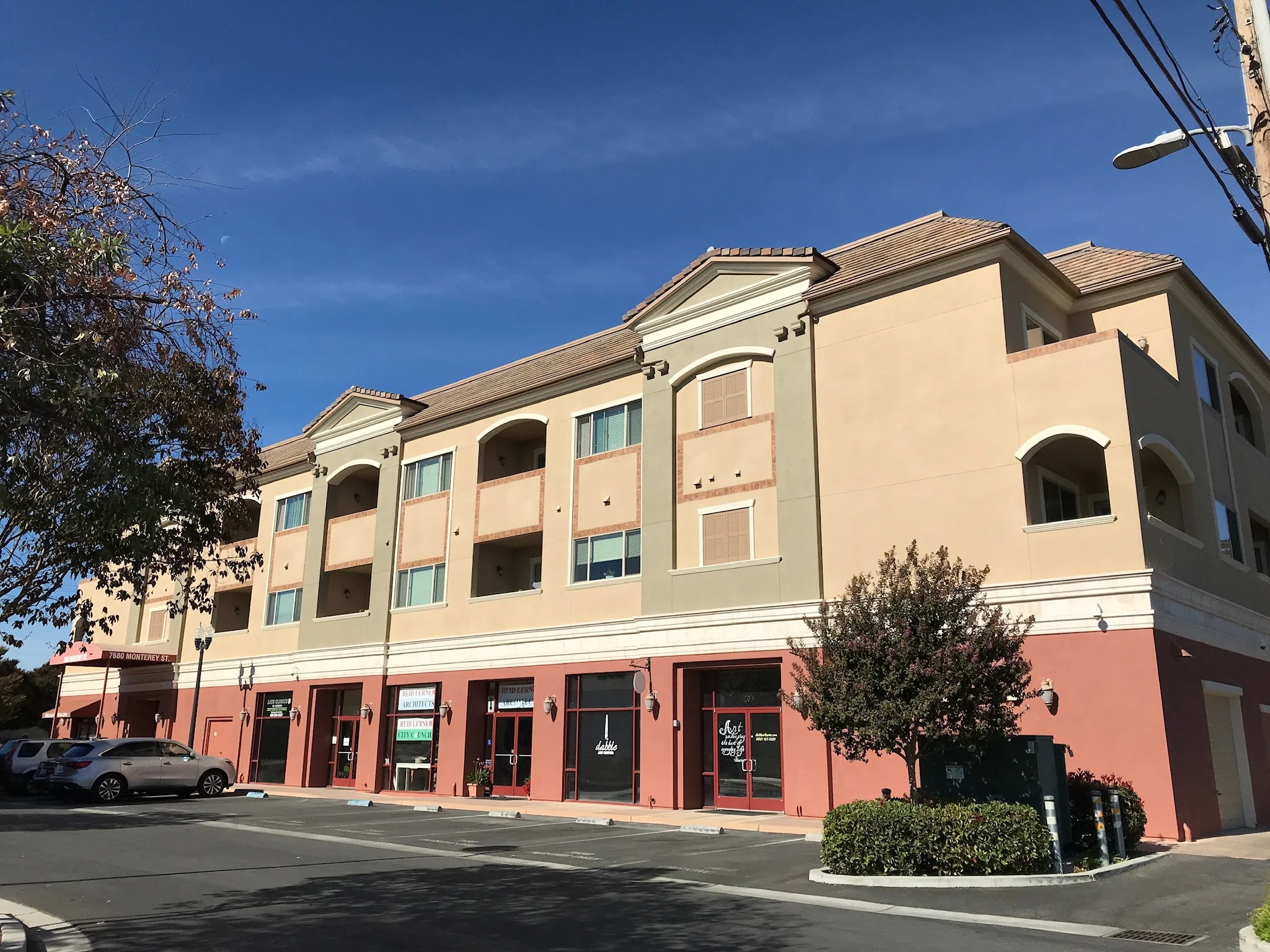 Corner view of Monterey Terrace Apartments, 3-story mixed-use building in Gilroy CA