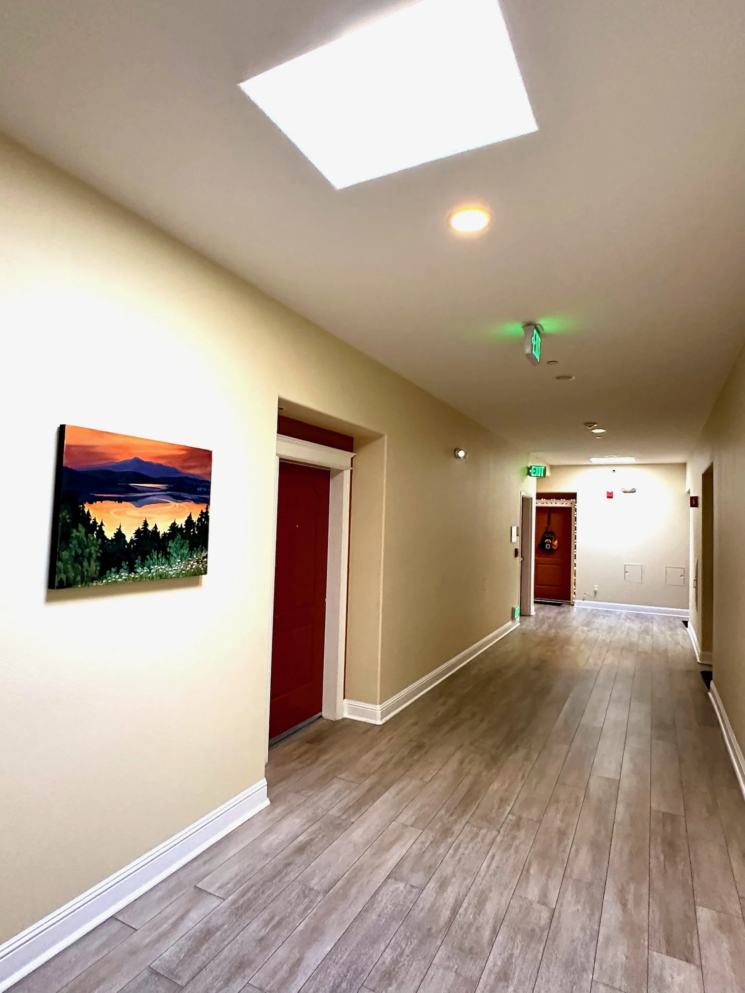 Wide hallway with skylights at Monterey Terrace Apartments in downtown Gilroy CA