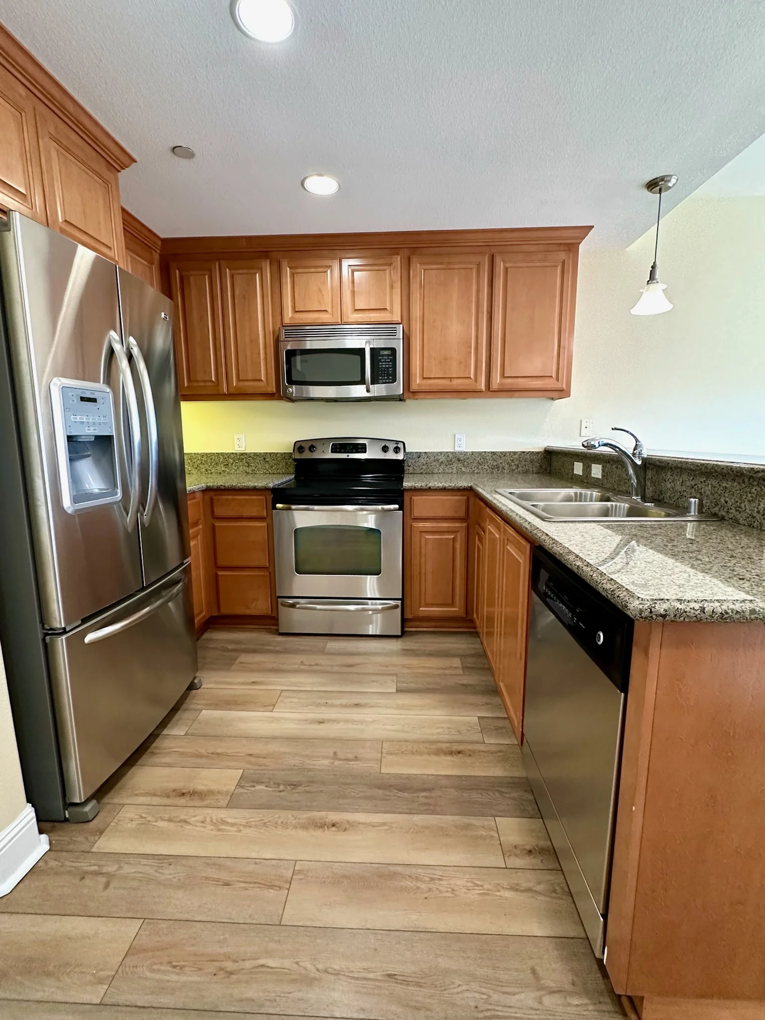 Kitchen with full appliances including dishwasher at Monterey Terrace Gilroy