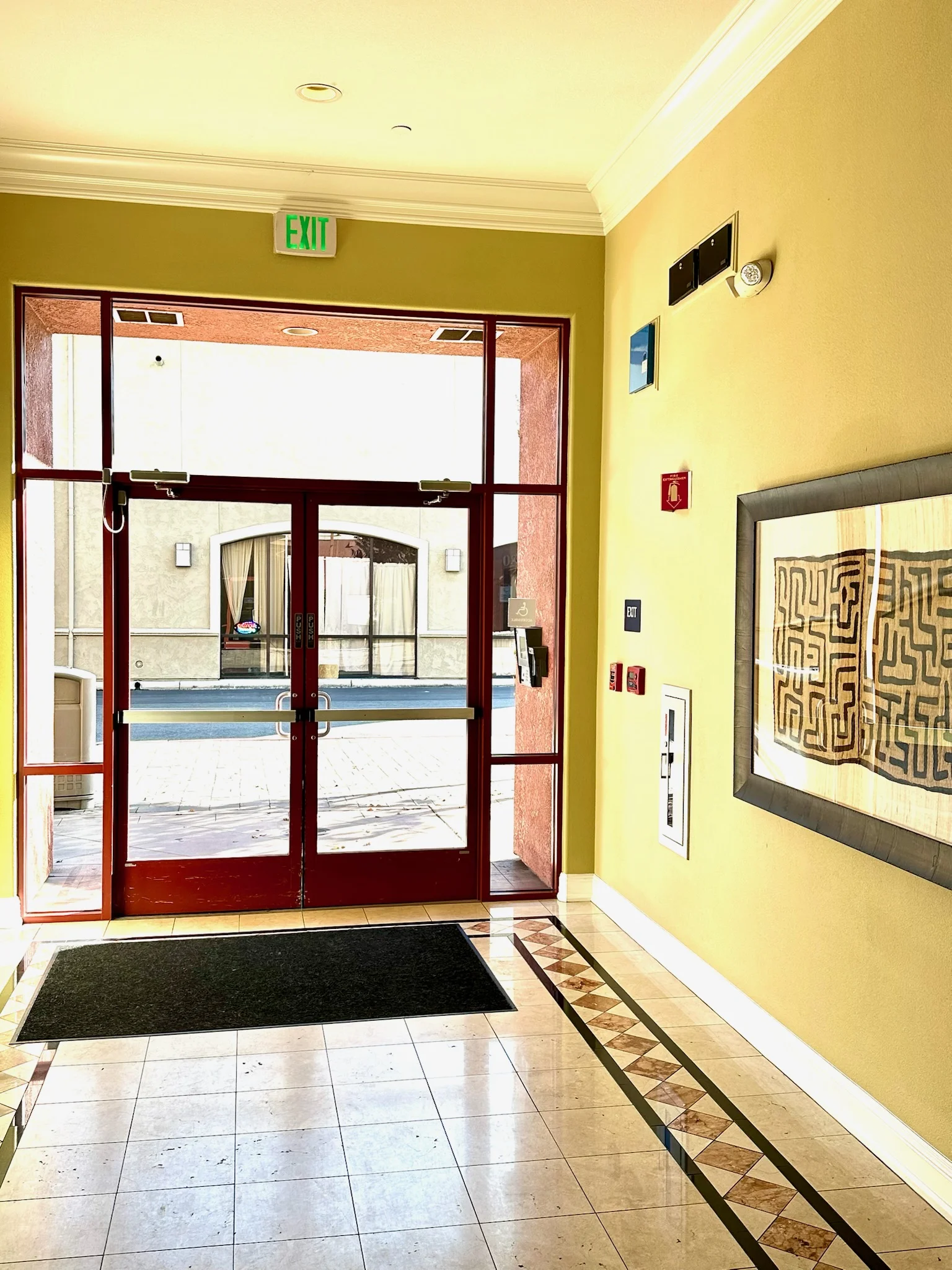 Secure glass entrance doors at Monterey Terrace luxury apartments in Gilroy CA