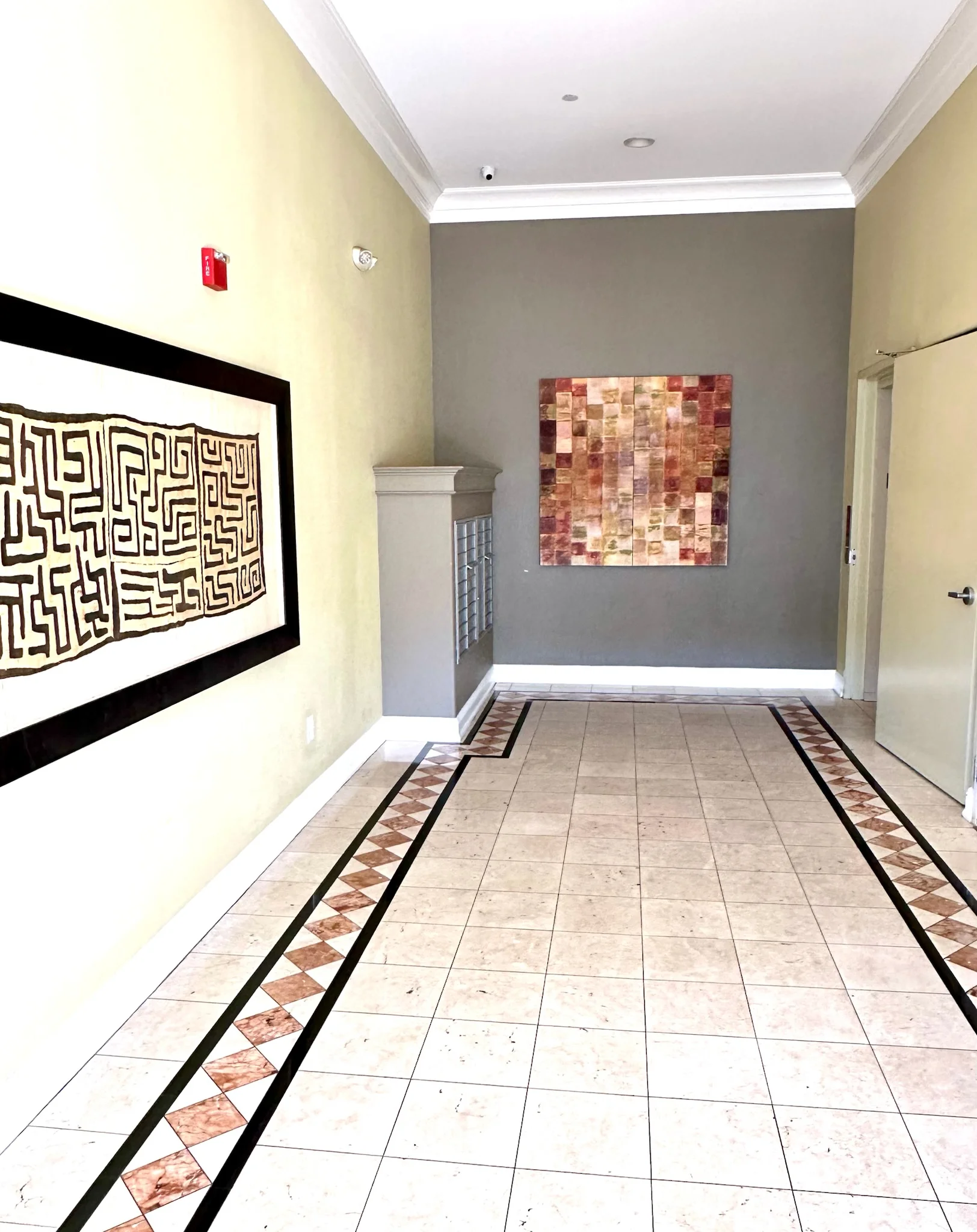 Elegant lobby with marble tile and artwork
