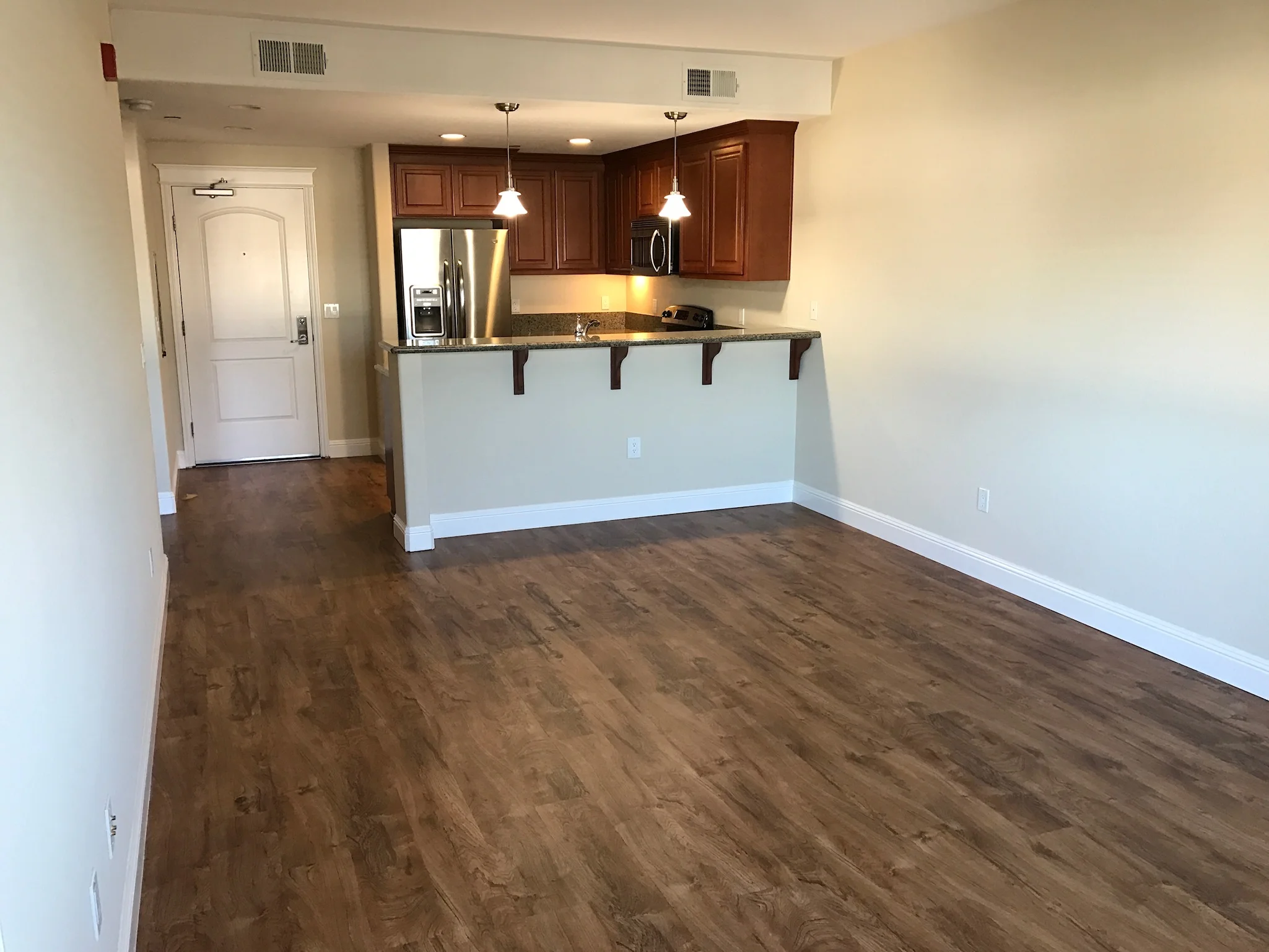 Open floor plan living and kitchen in Monterey Terrace apartment Gilroy CA