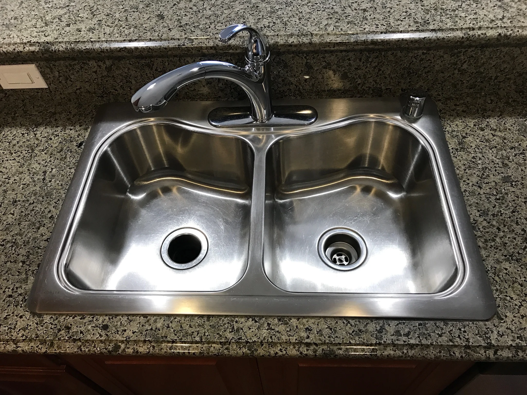 Stainless steel sink with granite counter in Gilroy apartment kitchen
