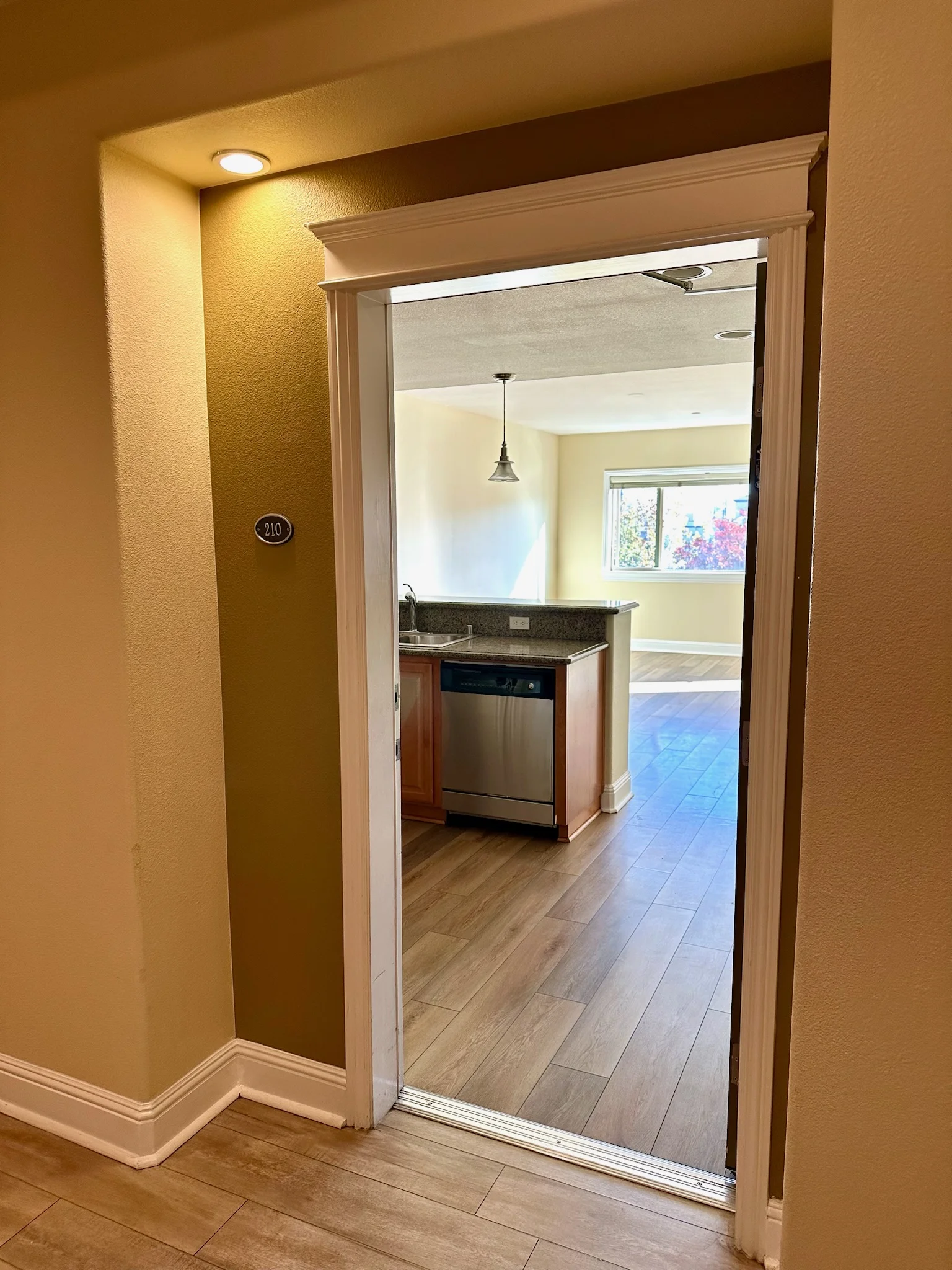 Unit 210 entry doorway at Monterey Terrace luxury apartments in Gilroy
