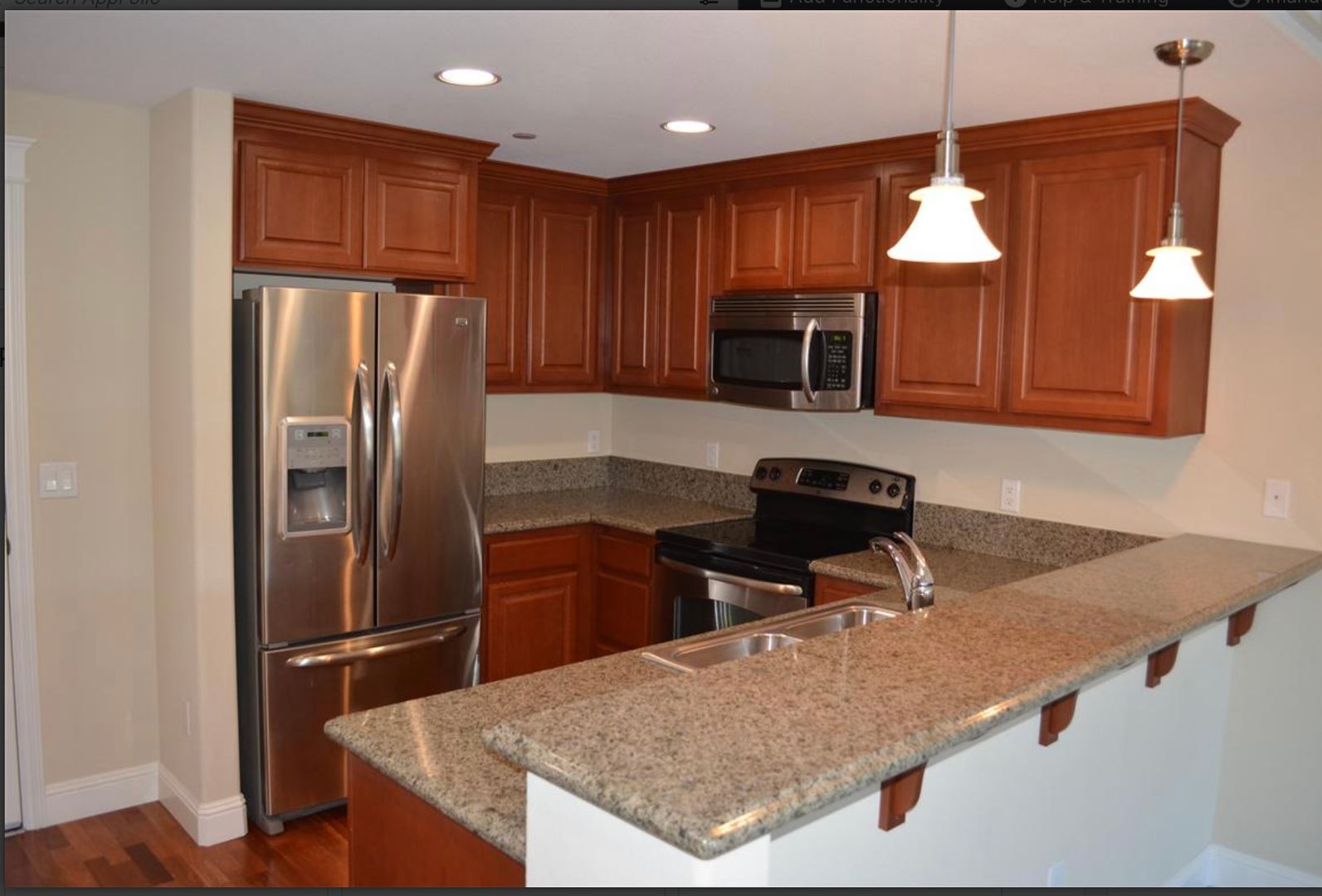 Kitchen with granite countertops in Unit 304